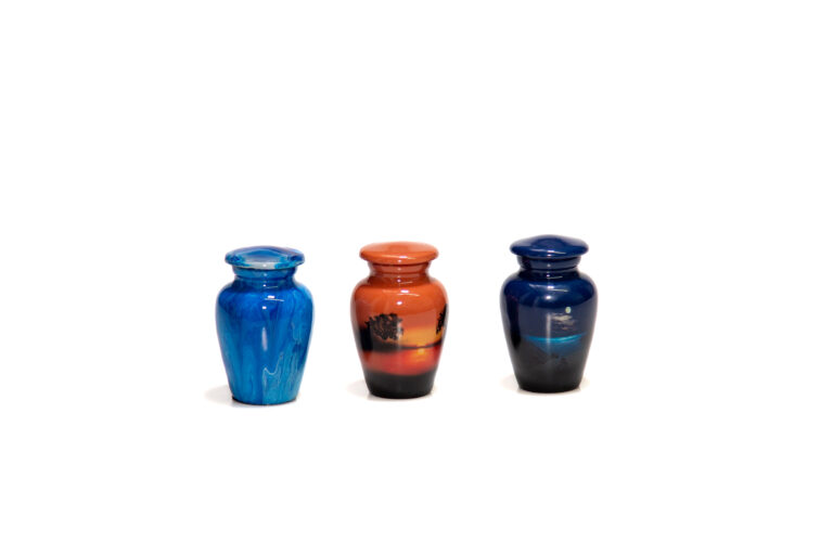 Three keepsake urns with Savanna, Blue Marble, and Blue Moon designs